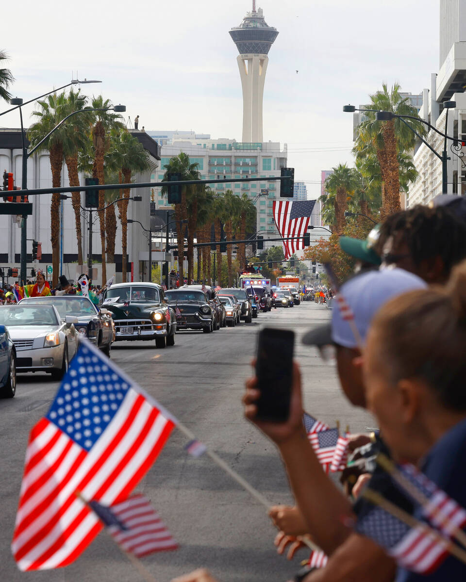 People watch the Annual Veterans Day Parade in downtown Las Vegas on Tuesday, Nov. 11, 2025. (B ...