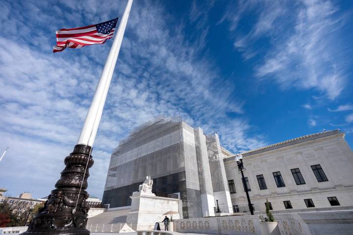 An American flag flies at half-staff outside the Supreme Court on Wednesday, Nov. 5, 2025, in W ...