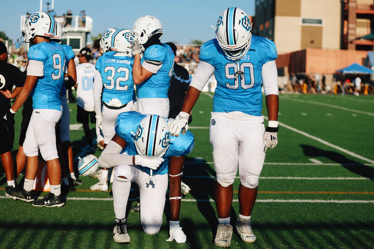Sloan Canyon teammates pray during a high school football game between Sloan Canyon and Foothil ...
