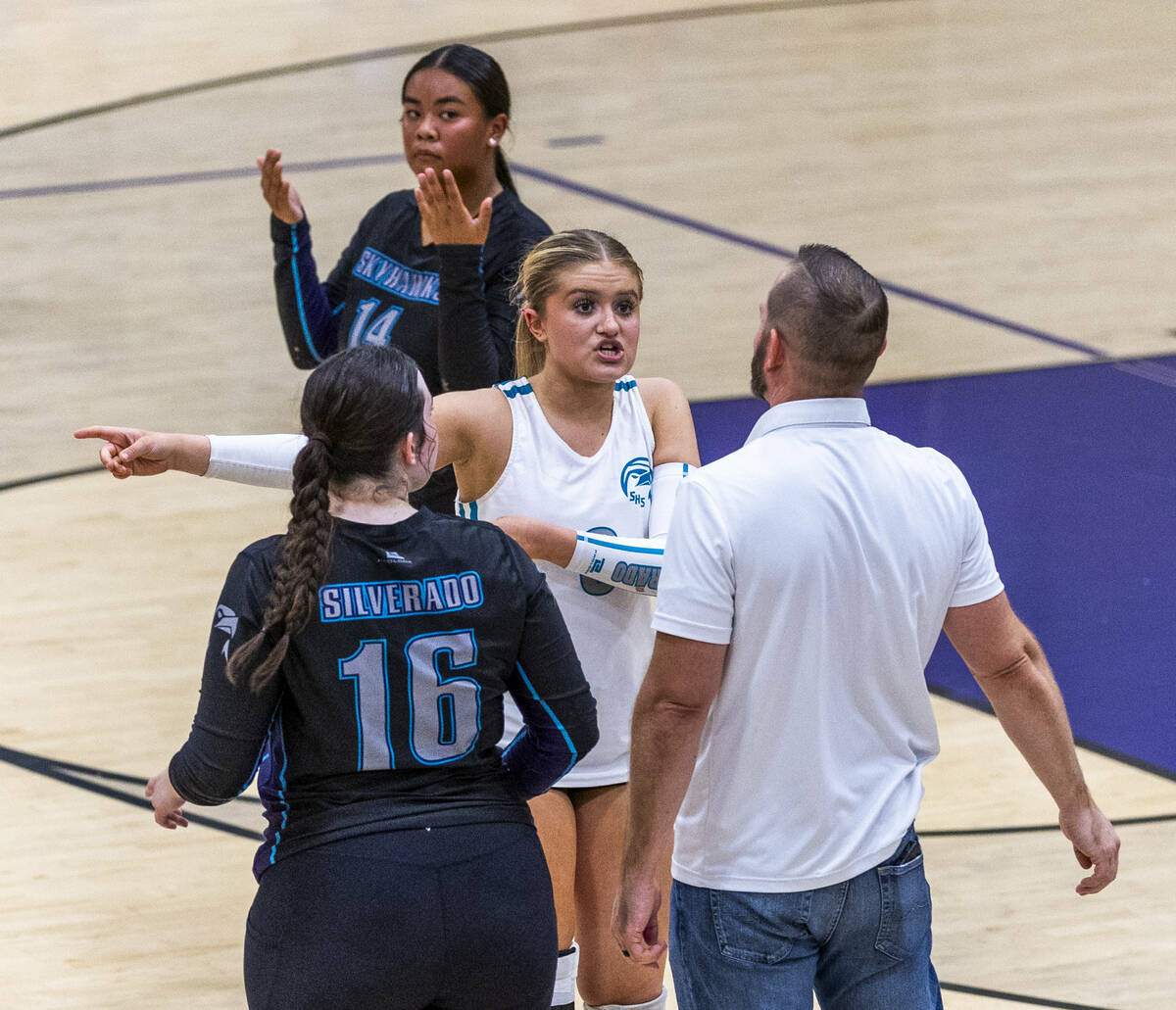Silverado's Xalia King (6) explains a lost point to head coach Kevin Schwallie against Sie ...