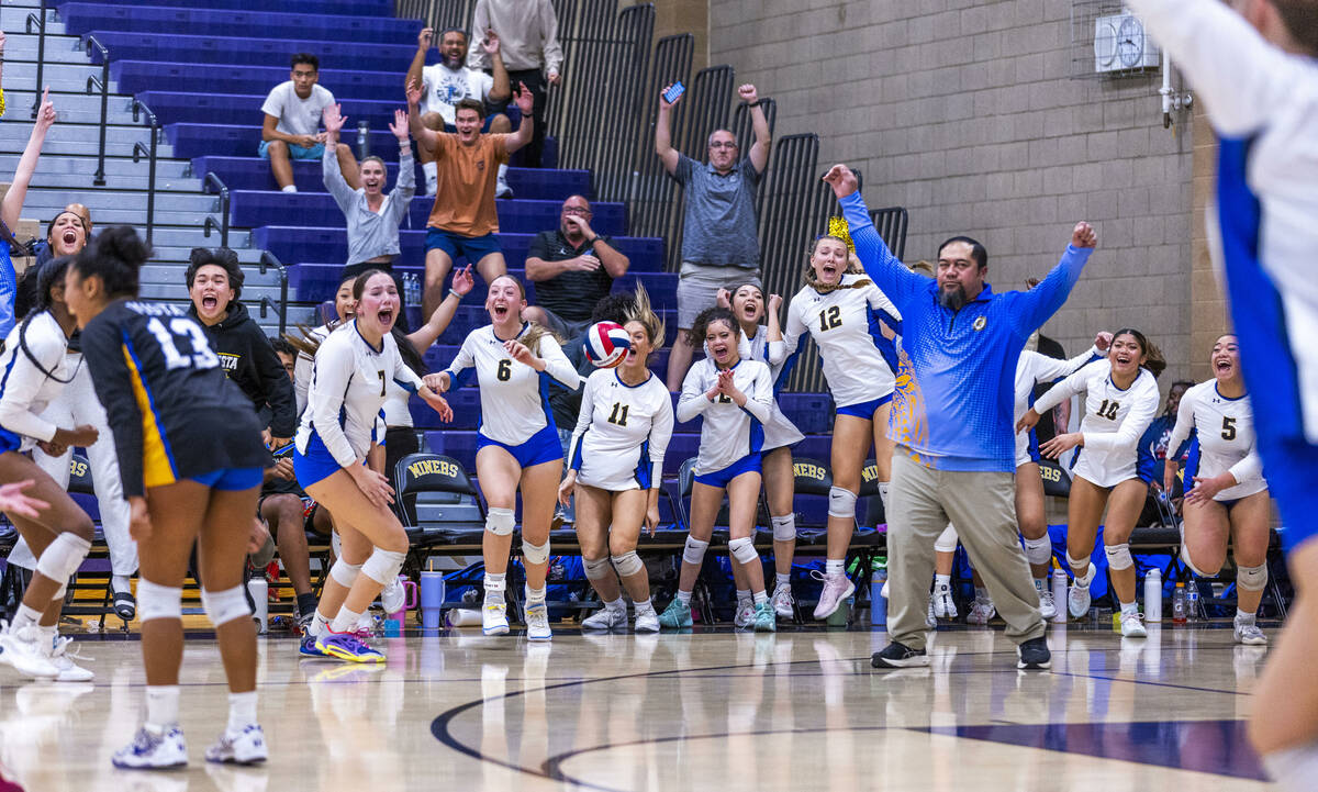 Sierra Vista players and head coach Raymond Maika begin to celebrate their match win over Silv ...