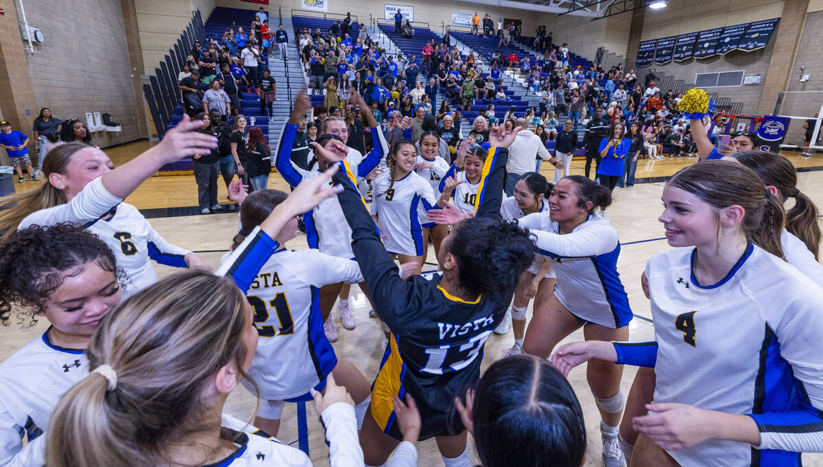 Sierra Vista players celebrate their match victory over Silverado and winning the 4A girls voll ...