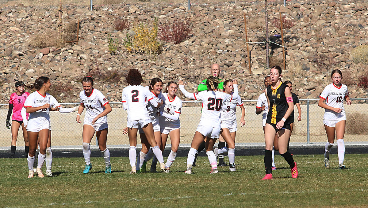 Doral Academy Red Rock girls soccer team celebrates after scoring against Galena during the NIA ...