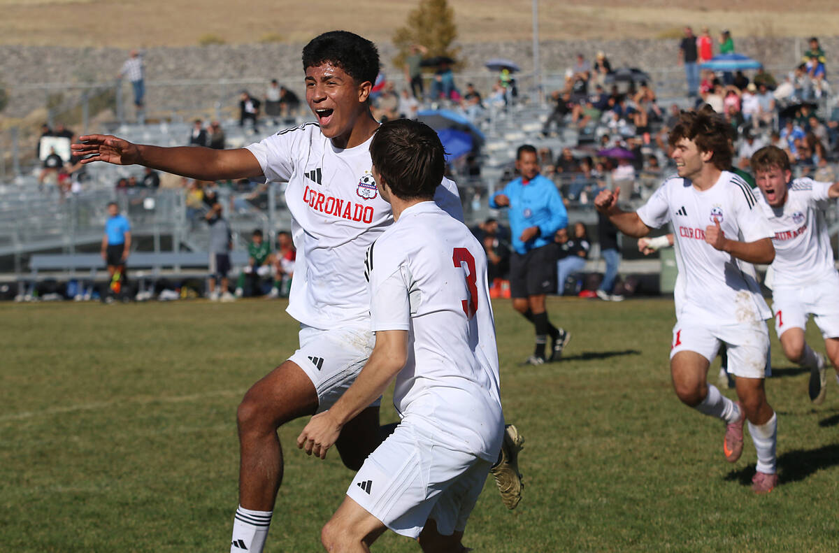 Coronado’s Josh Pineda, on left, celebrates after scoring the game winning goal against Hug t ...