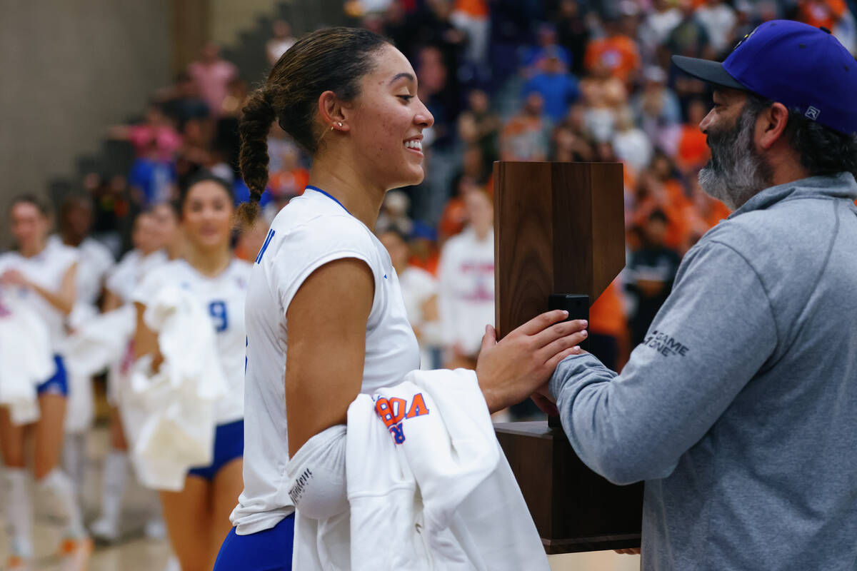Bishop Gorman outside hitter Ayanna Watson receives the trophy after the Gaels’ win over ...