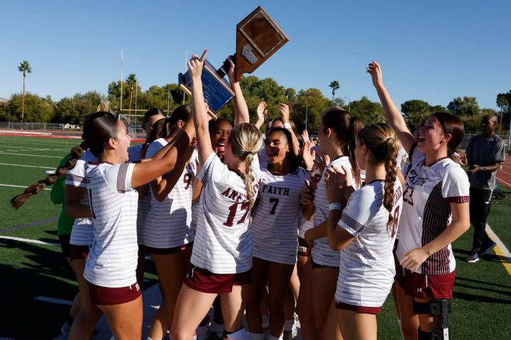 Faith Lutheran girls soccer team celebrate after defeating Coronado in overtime in a Class 5A g ...