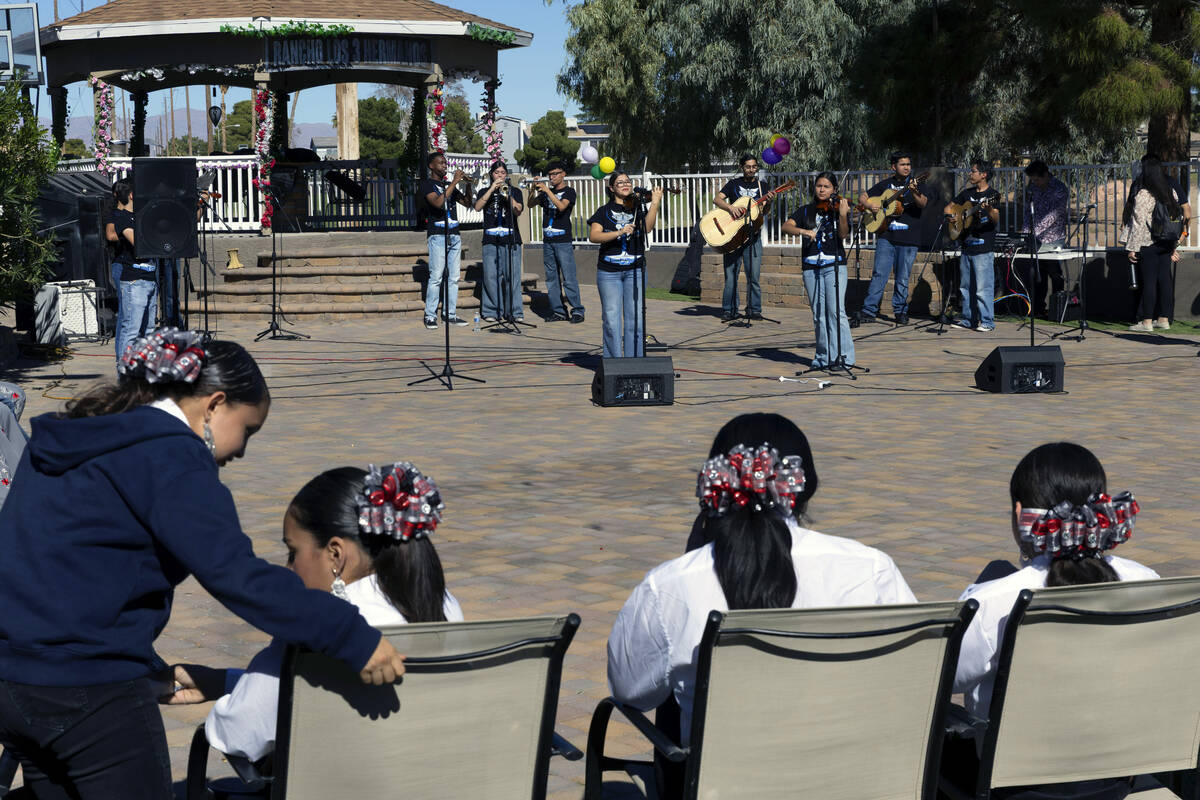 Performers with the student mariachi group from Canyon Springs High School entertain the crowd ...