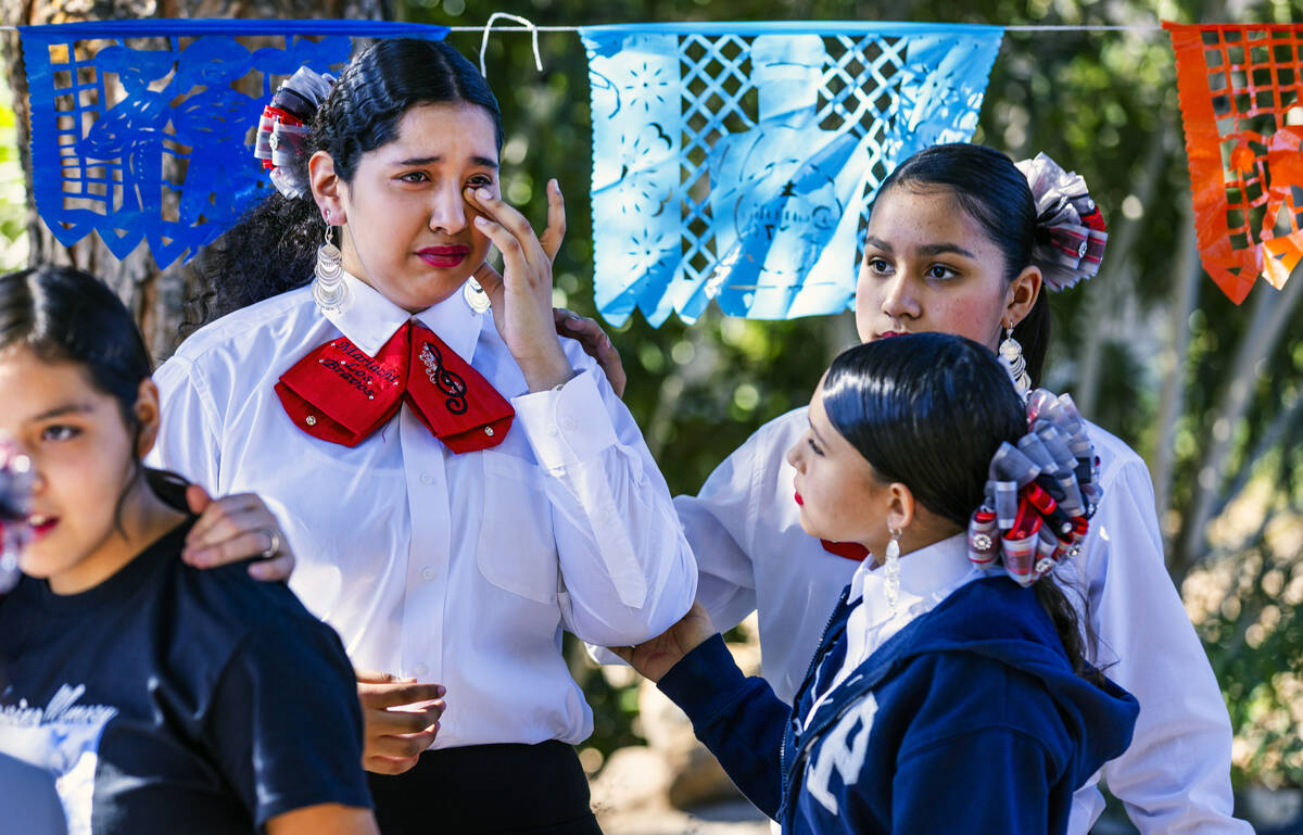 Musicians with the student mariachi band form the J.D. Smith Middle School become emotional whe ...