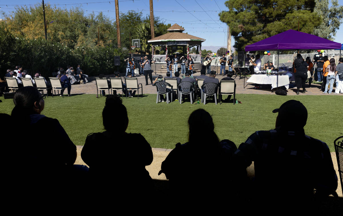 Performers with the student mariachi group from Canyon Springs High School entertain the crowd ...