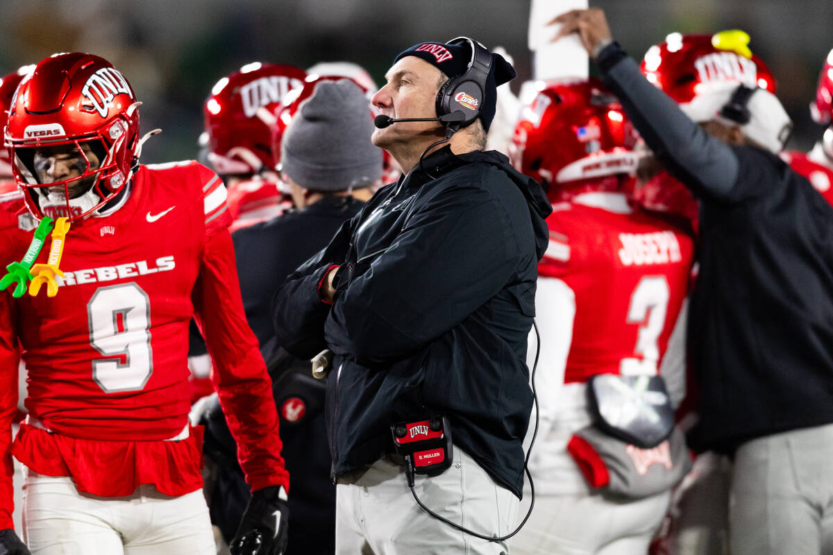 UNLV Head Coach Dan Mullen looks at the scoreboard during the first half of their NCAA football ...