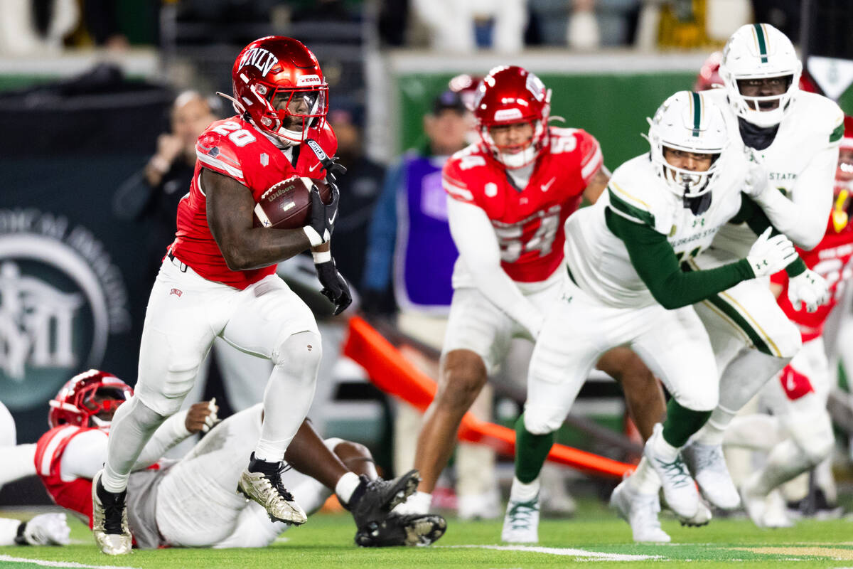 UNLV running back Jaylon Glover (20) returns a kick off against the Colorado State Rams during ...