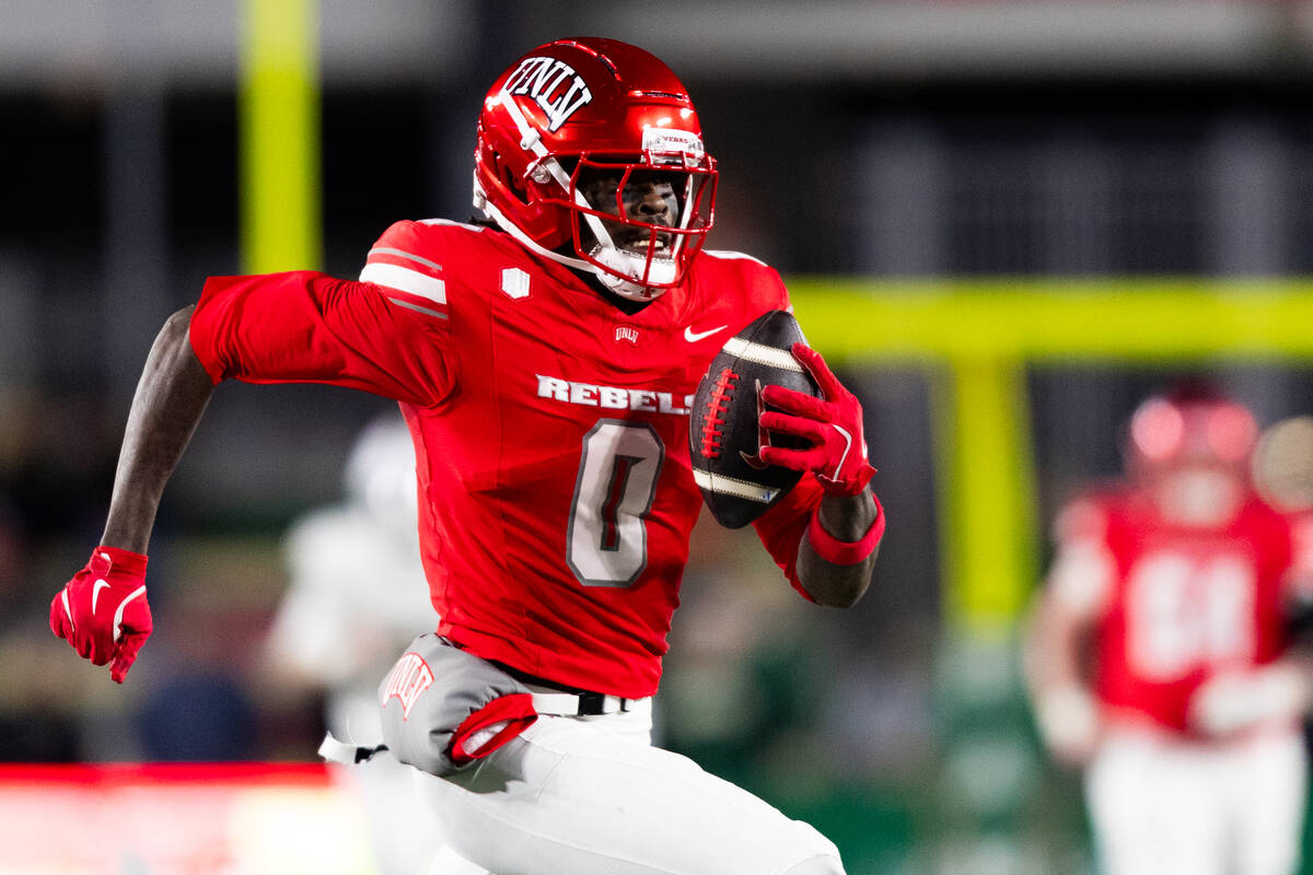 UNLV wide receiver Troy Omeire (0) runs with the ball against the Colorado State Rams during th ...