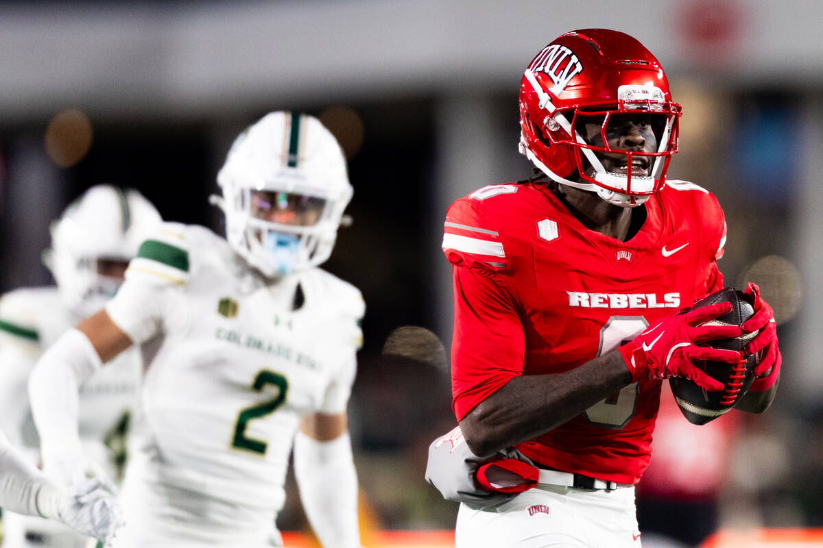 UNLV wide receiver Troy Omeire (0) runs with the ball against the Colorado State Rams during th ...