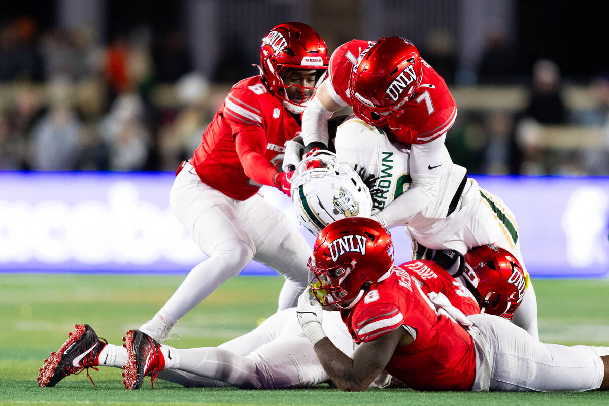 UNLV defense tackles Colorado State Rams wide receiver Lavon Brown (8) during the second half o ...