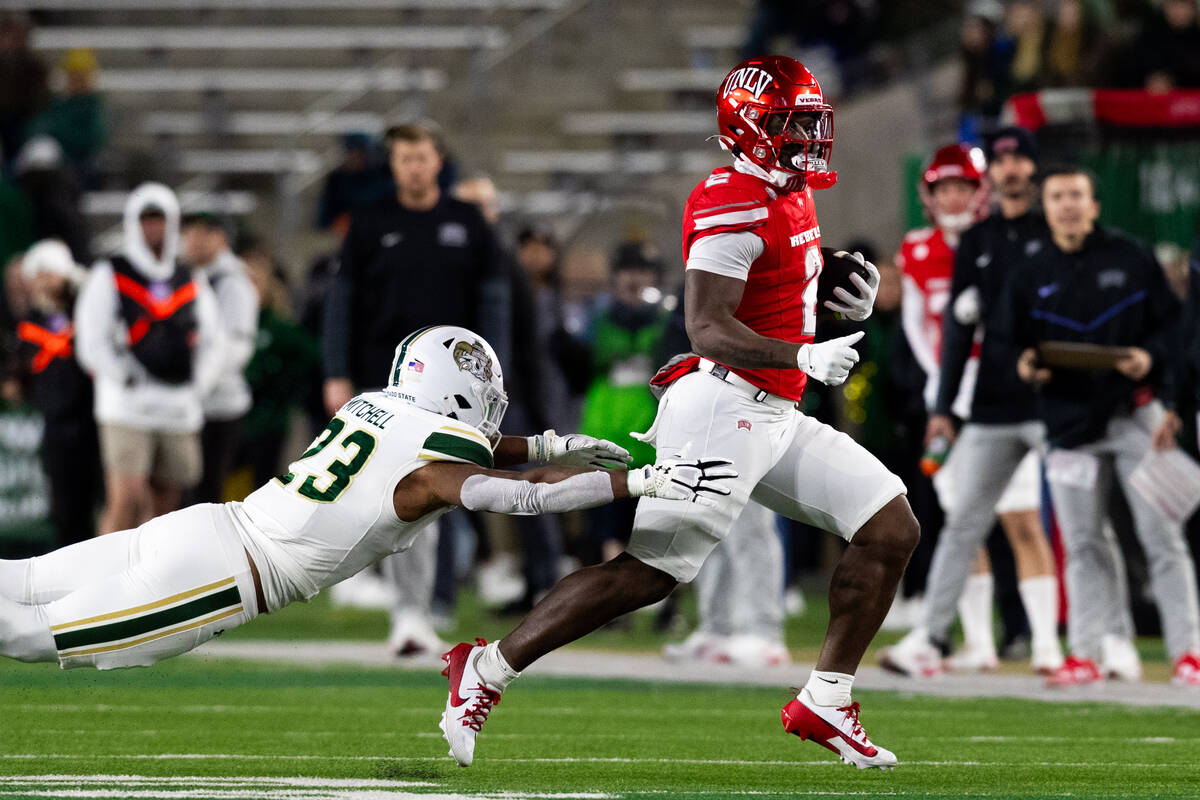 UNLV running back Keyvone Lee (2) attempts to outrun Colorado State Rams linebacker Jaseim Mitc ...