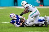 Buffalo Bills quarterback Josh Allen (17) is sacked by Miami Dolphins safety Minkah Fitzpatrick ...