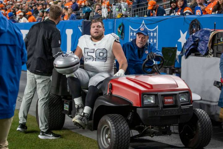 Raiders guard Jackson Powers-Johnson (58) leaves the field after being injured during the first ...