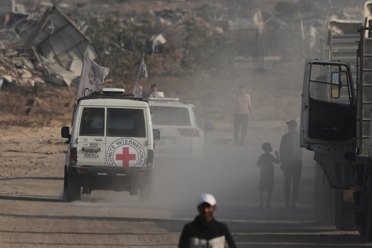 Red Cross convoy carrying what Hamas claims is the remains of an Israeli soldier who was killed ...