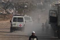 Red Cross convoy carrying what Hamas claims is the remains of an Israeli soldier who was killed ...