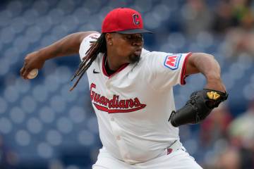 Cleveland Guardians' Luis Ortiz pitches in the first inning of a baseball game against the Min ...