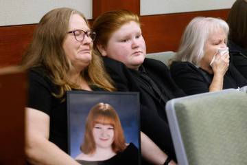 Tiffany Reynolds, left, holding a photograph of her daughter McKenzie Scott, her son Kasen, 12, ...
