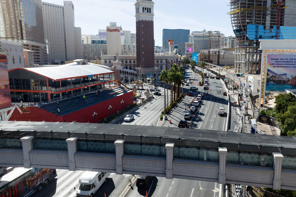 Aluminum walls are installed to block the view of the Las Vegas Grand Prix race on a pedestrian ...