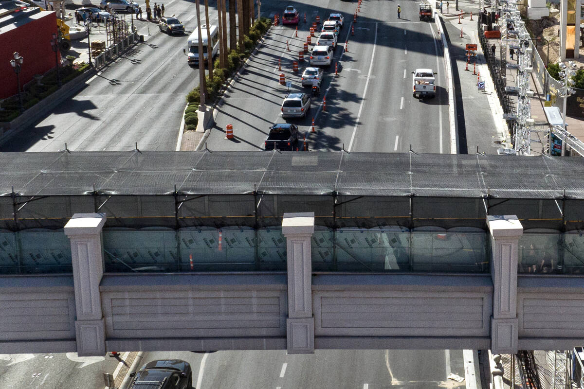 Aluminum walls are installed to block the view of the Las Vegas Grand Prix race on a pedestrian ...