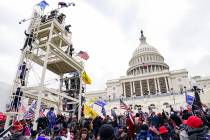 FILE - Violent insurrectionists loyal to President Donald Trump breach the U.S. Capitol in Wash ...