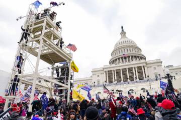 FILE - Violent insurrectionists loyal to President Donald Trump breach the U.S. Capitol in Wash ...
