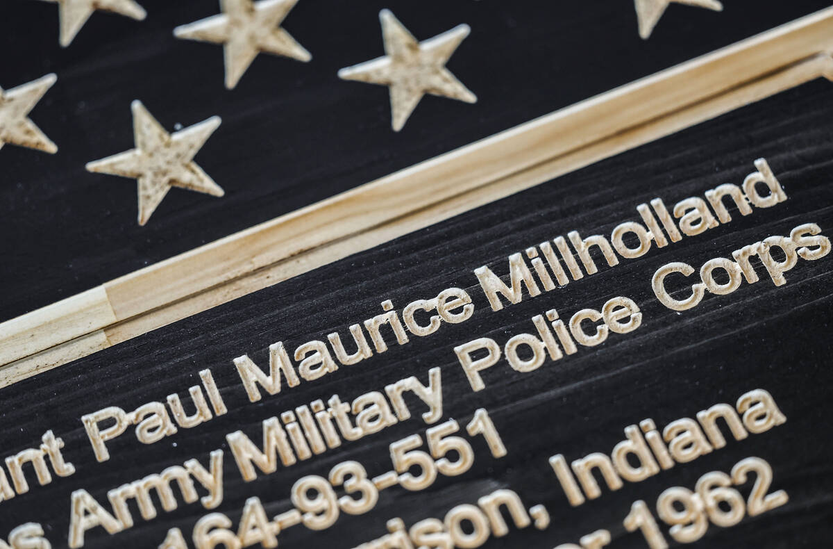 A plaque acknowledging the service of U.S. Army veteran Paul Millholland is photographed at fam ...