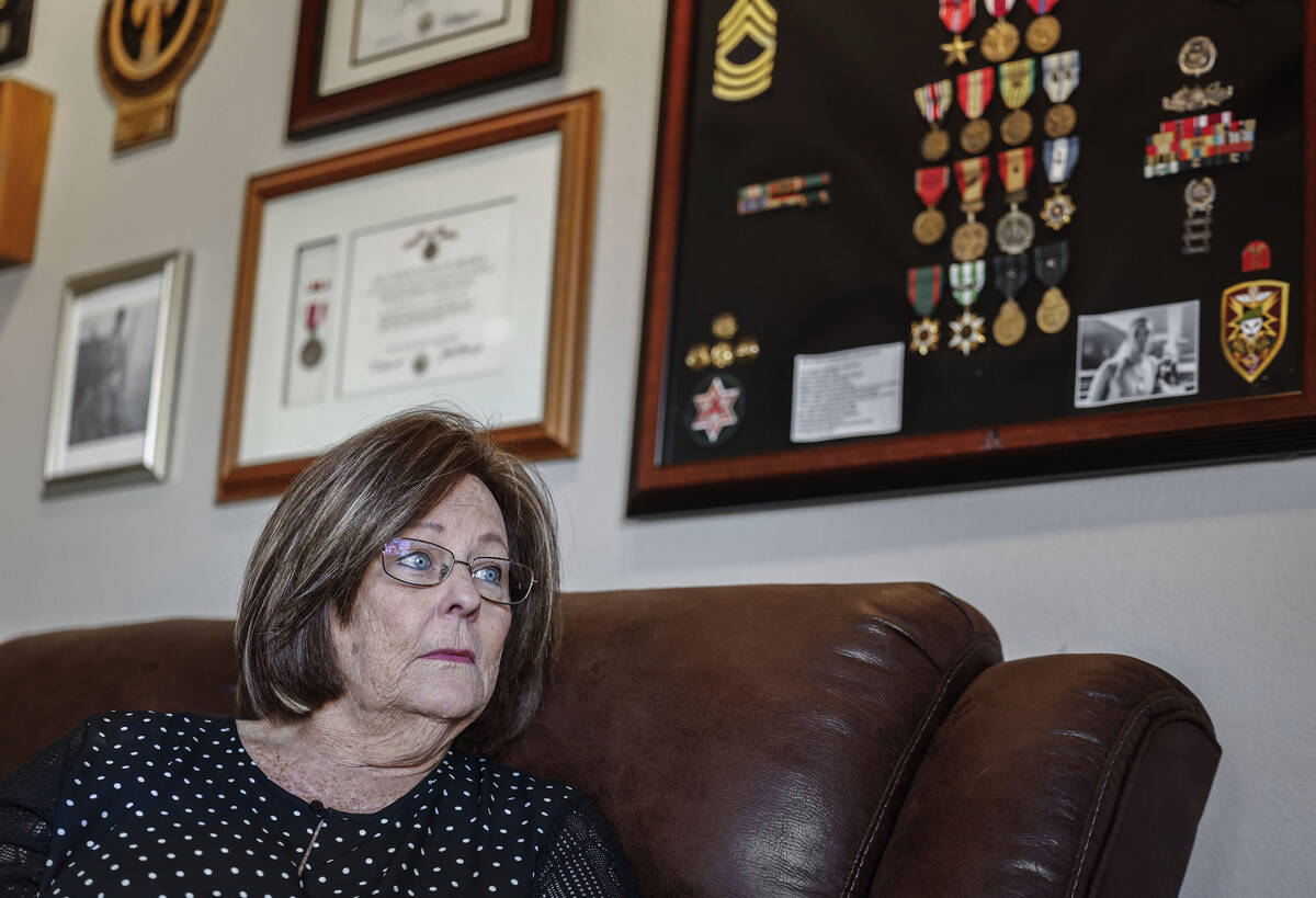 Janis Millholland, the widow of U.S. Army veteran Paul Millholland, poses for a photograph Frid ...