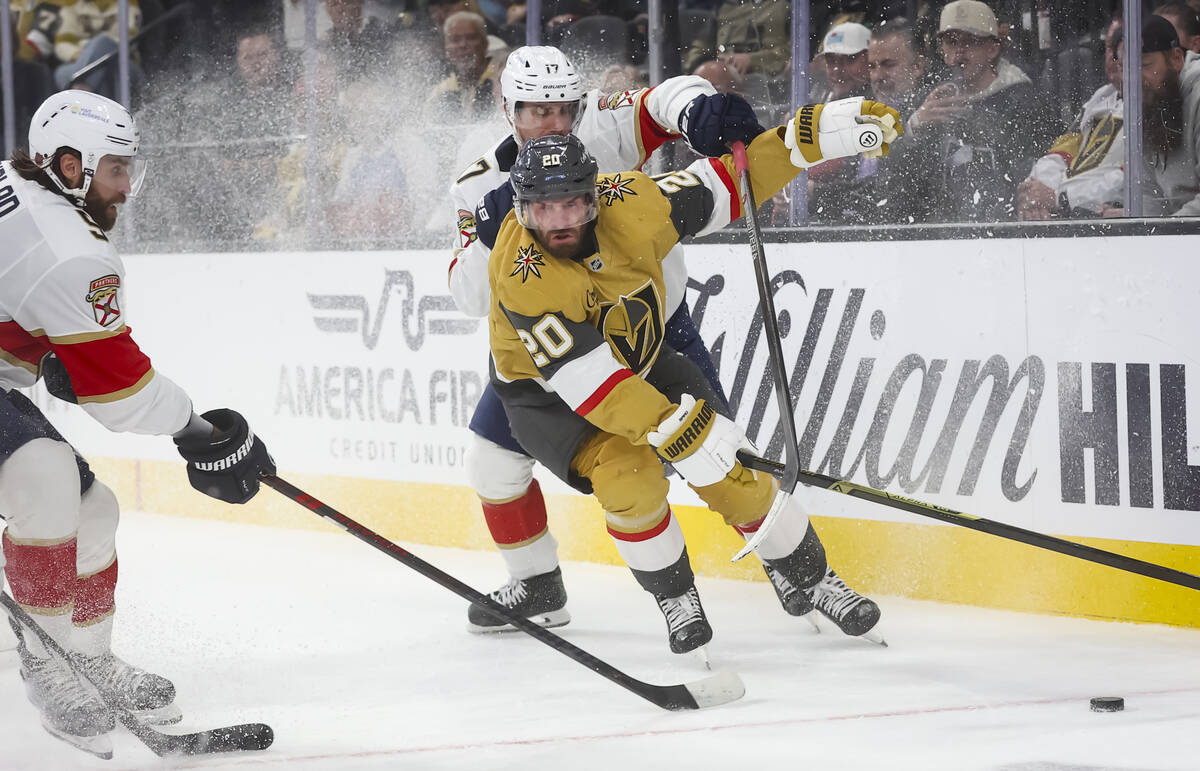 Golden Knights left wing Brandon Saad (20) and Florida Panthers center Evan Rodrigues (17) vie ...
