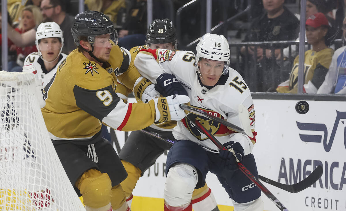 Golden Knights center Jack Eichel (9) and Florida Panthers center Anton Lundell (15) vie for th ...