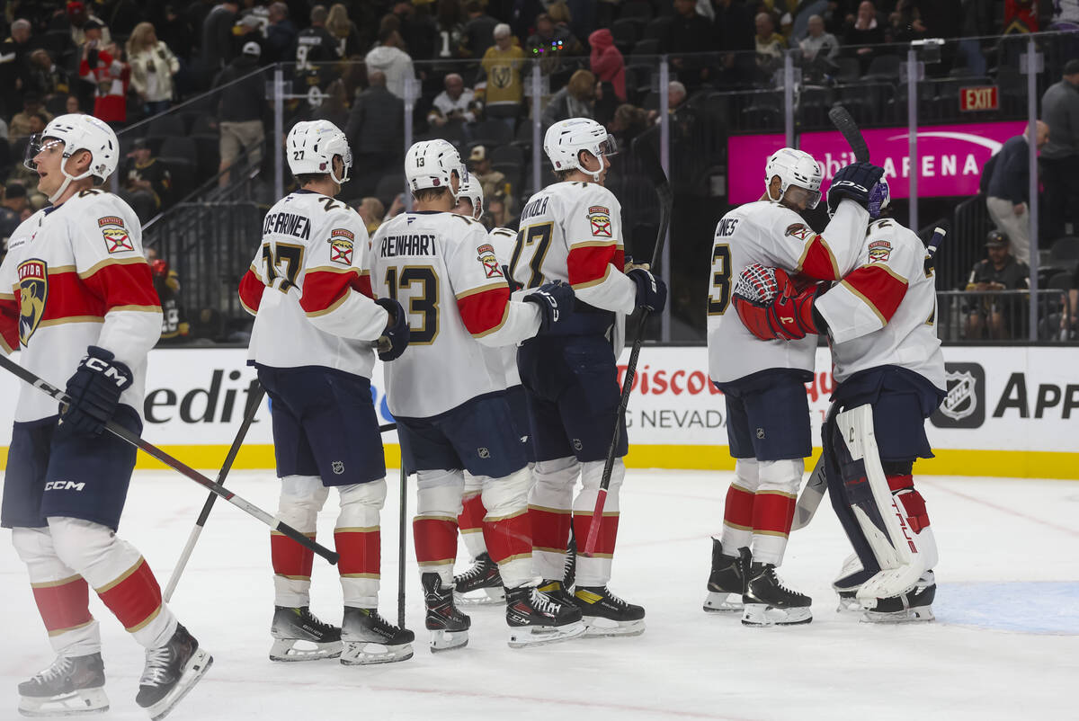 The Florida Panthers celebrate after defeating the Golden Knights in an NHL hockey game at T-Mo ...