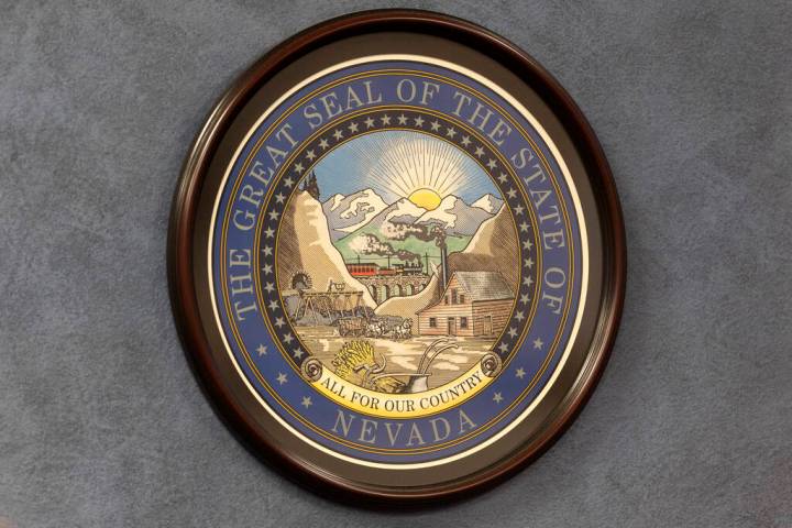 The Great Seal of the State of Nevada is hung on a wall in the Nevada Legislature. (Ellen Schmi ...