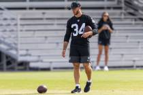 Raiders kicker Greg Joseph (34) sets up footballs for a drill during the team’s practice ...