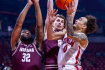 UNLV guard Dra Gibbs-Lawhorn (0) works inside to get a shot off against Montana Grizzlies guard ...