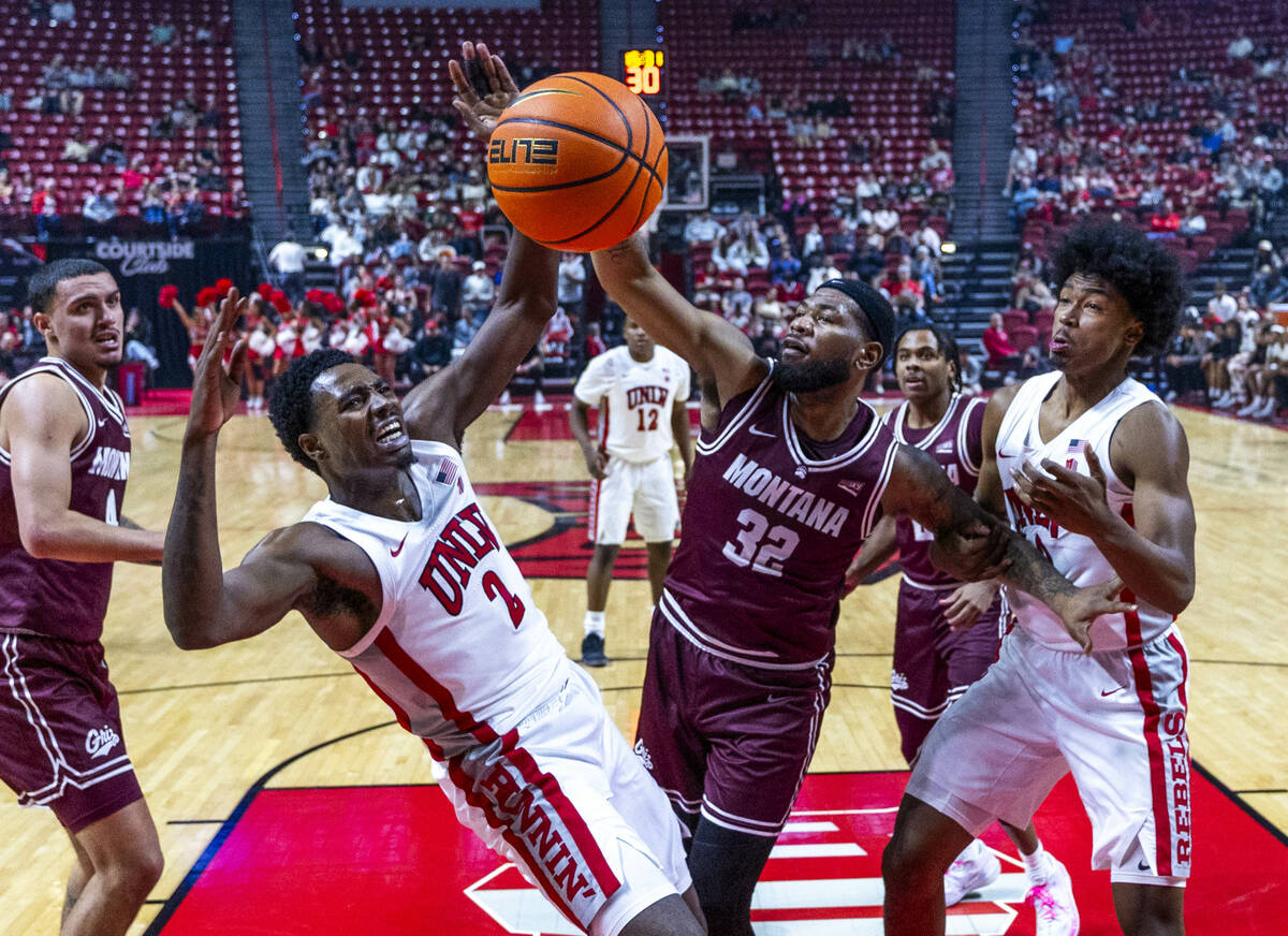 UNLV forward Kimani Hamilton (2) battles for a loose ball with Montana Grizzlies forward Te&#03 ...