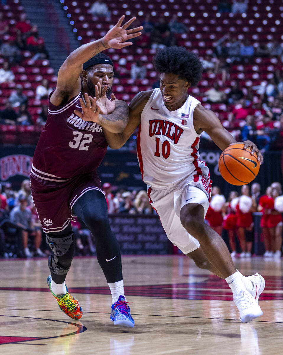UNLV forward Jacob Bannarbie (10) battles in the lane against Montana Grizzlies forward Te&#039 ...
