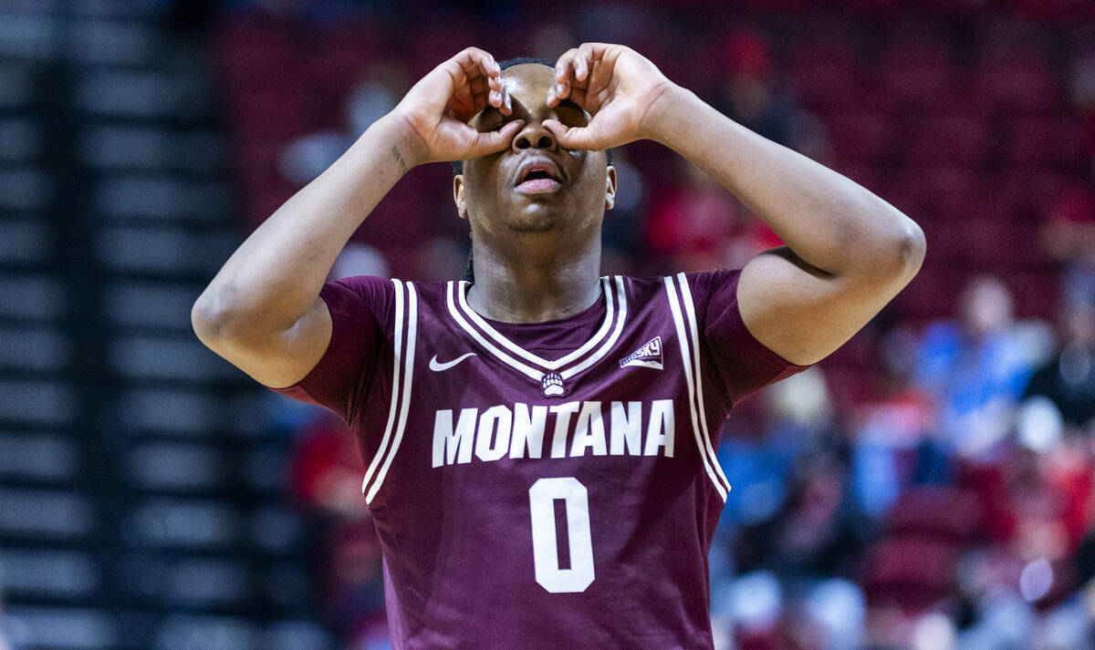 Montana Grizzlies guard Money Williams (0) has his sites set on the basket against UNLV during ...
