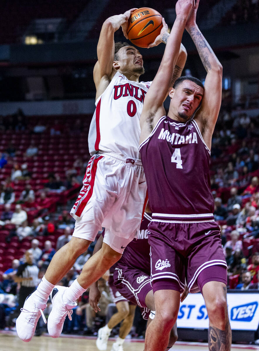 UNLV guard Dra Gibbs-Lawhorn (0) is able to adjust for a basket past Montana Grizzlies guard Ty ...