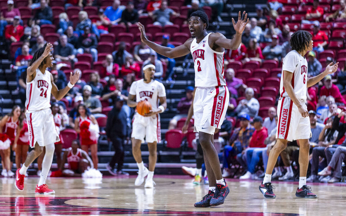 UNLV forward Kimani Hamilton (2) declares that he never touched a Montana Grizzlies ball headin ...