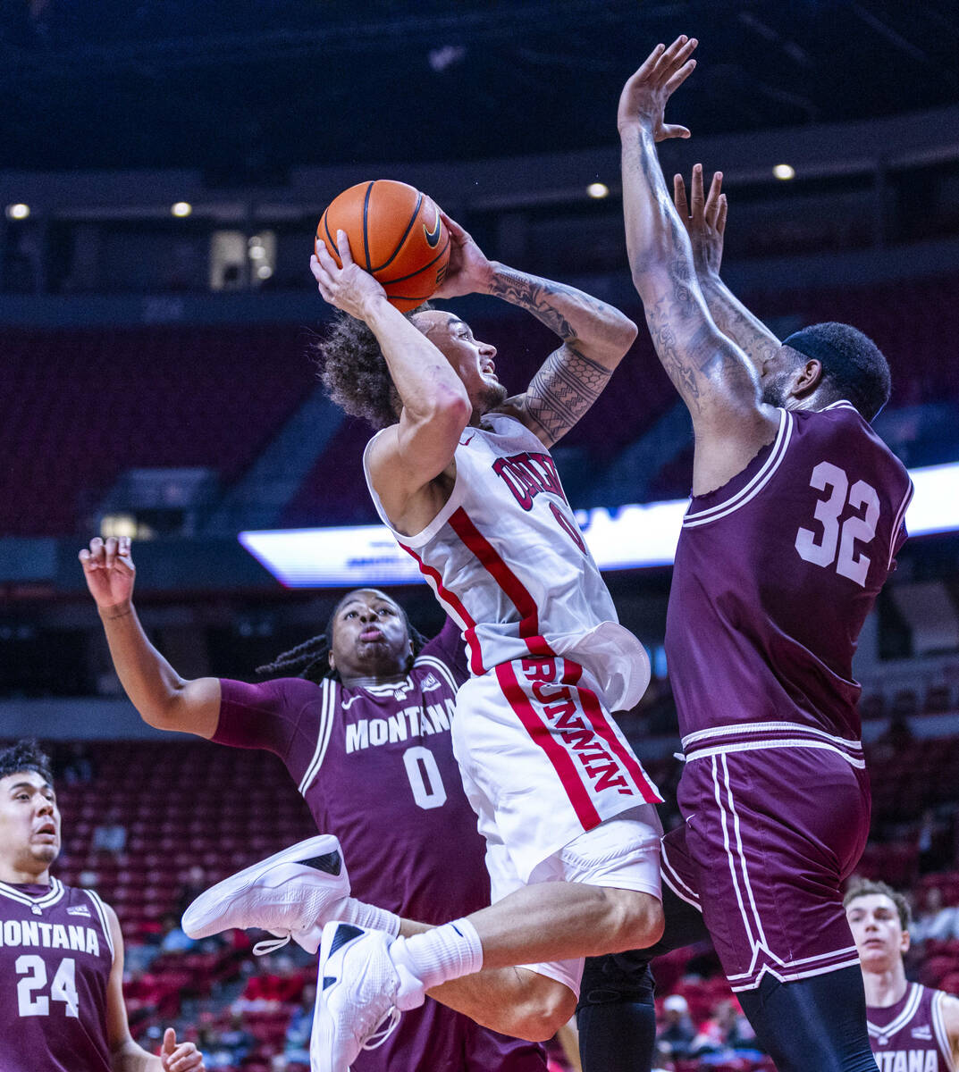 UNLV guard Dra Gibbs-Lawhorn (0) elevates to shoot over Montana Grizzlies forward Te'Jon S ...