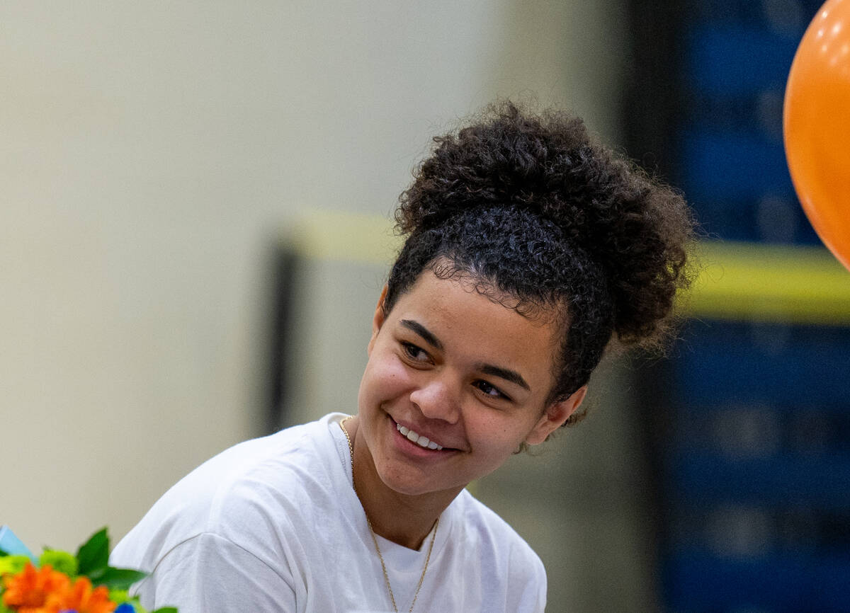 Aaliah Spaight looks on as basketball coach Sheryl Krmpotich talks about her basketball career ...
