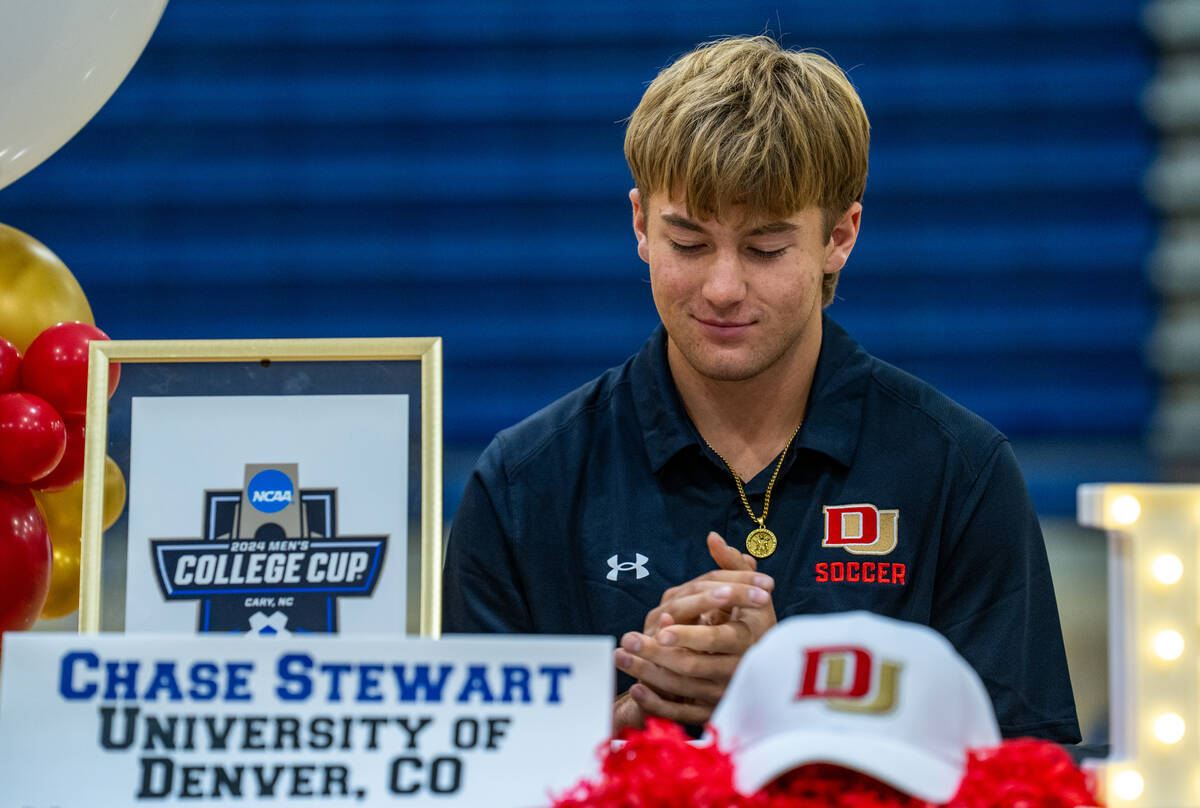 Chase Stewart claps for his fellow athletes during Bishop Gorman High School’s signing d ...