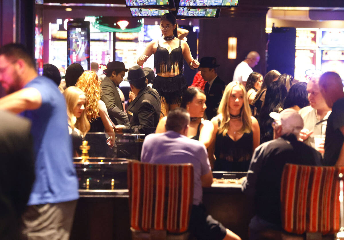 Guests play blackjack and roulette at the Golden Gate hotel-casino in downtown Las Vegas, on Su ...