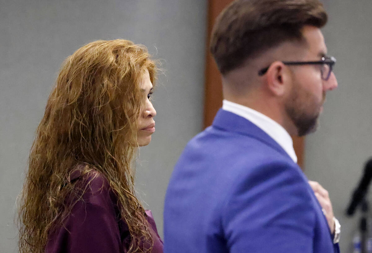 Devyn Michaels, who is accused of killing her on-and-off boyfriend, appears in court with her a ...