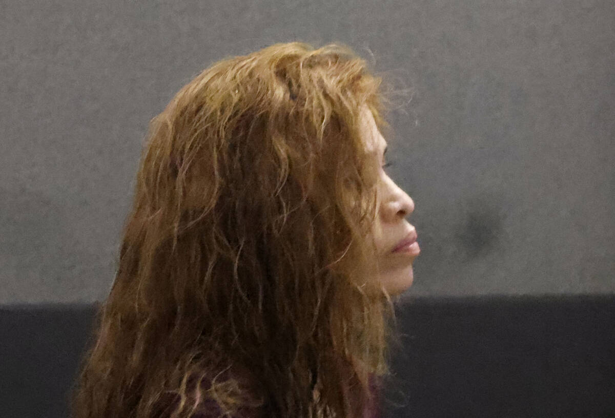 Devyn Michaels, who is accused of killing her on-and-off boyfriend, appears in court during her ...
