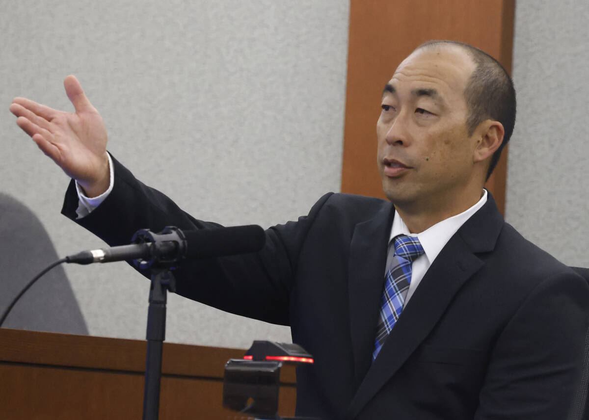Dennis Ozawa, a Henderson police detective, gestures toward Devyn Michaels, who is accused of k ...