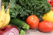 Groceries lay on a kitchen counter before being sorted for storage in the pantry and refrigerat ...